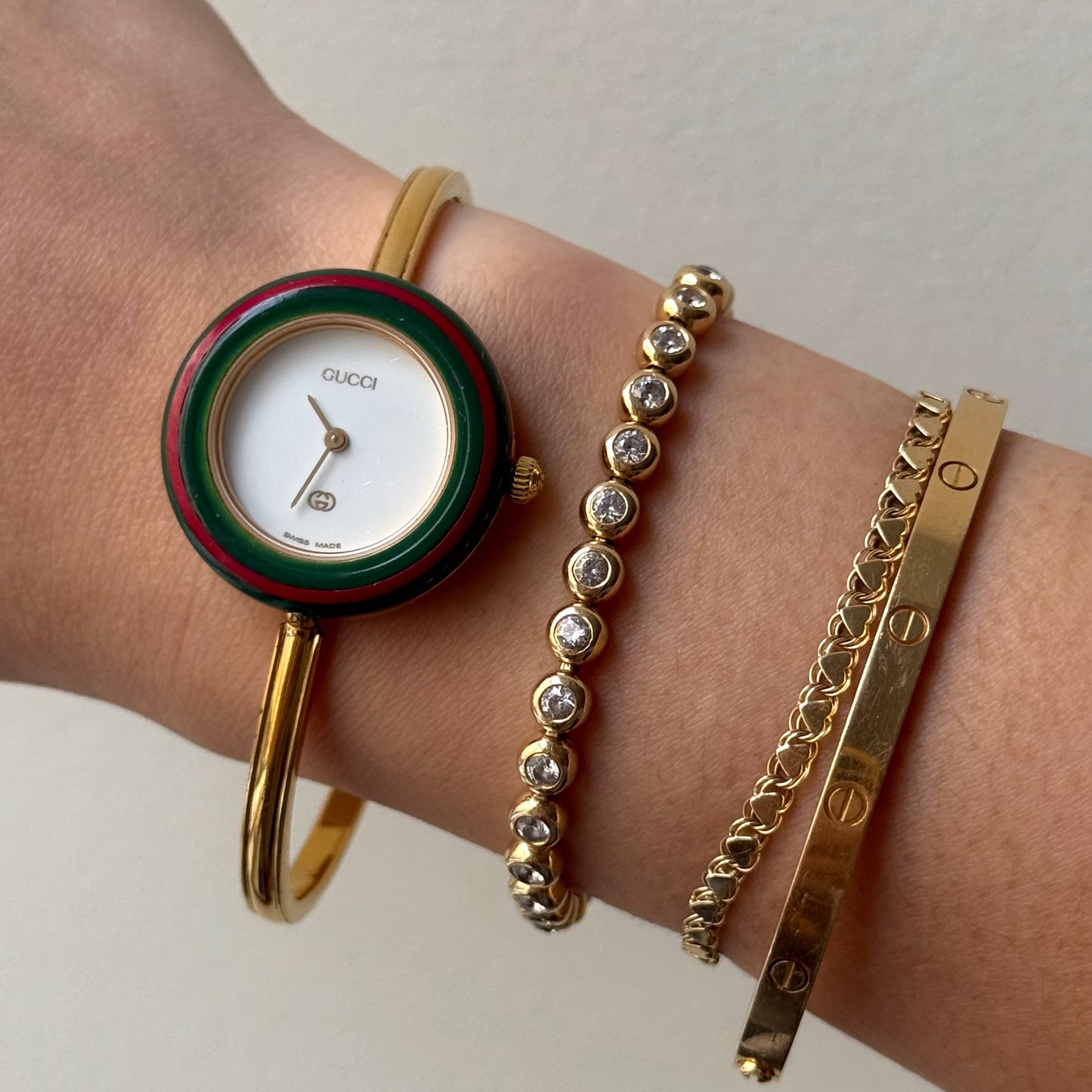 Gucci Gold Bangle Bezel Watch w/ 11 interchangeable Bezels & Box